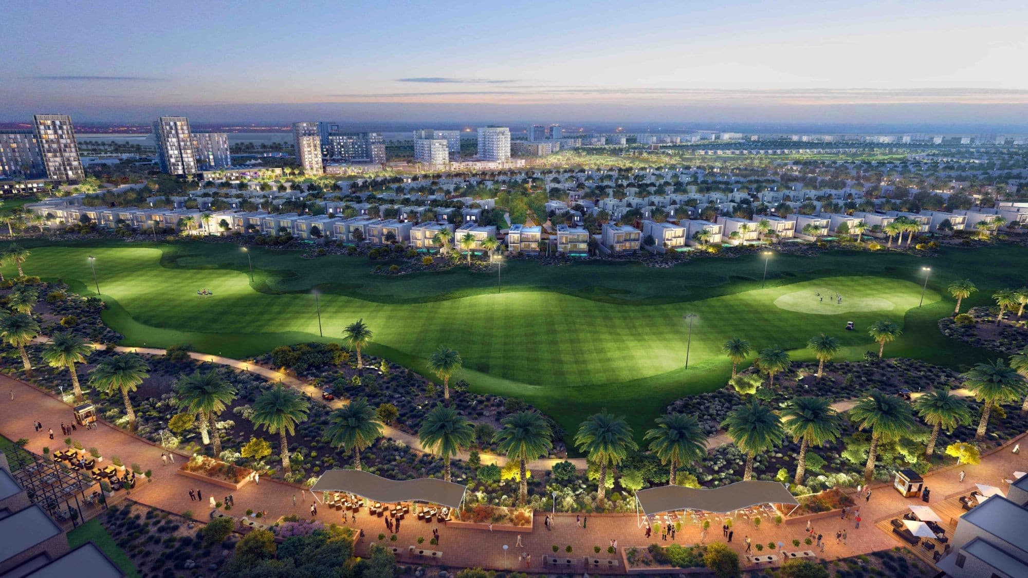 Render of Emaar South villas along the floodlit golf course at dusk