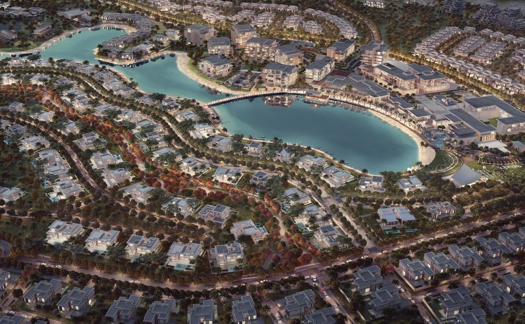 Render of Tilal Al Ghaf at dusk with villas around the lagoon