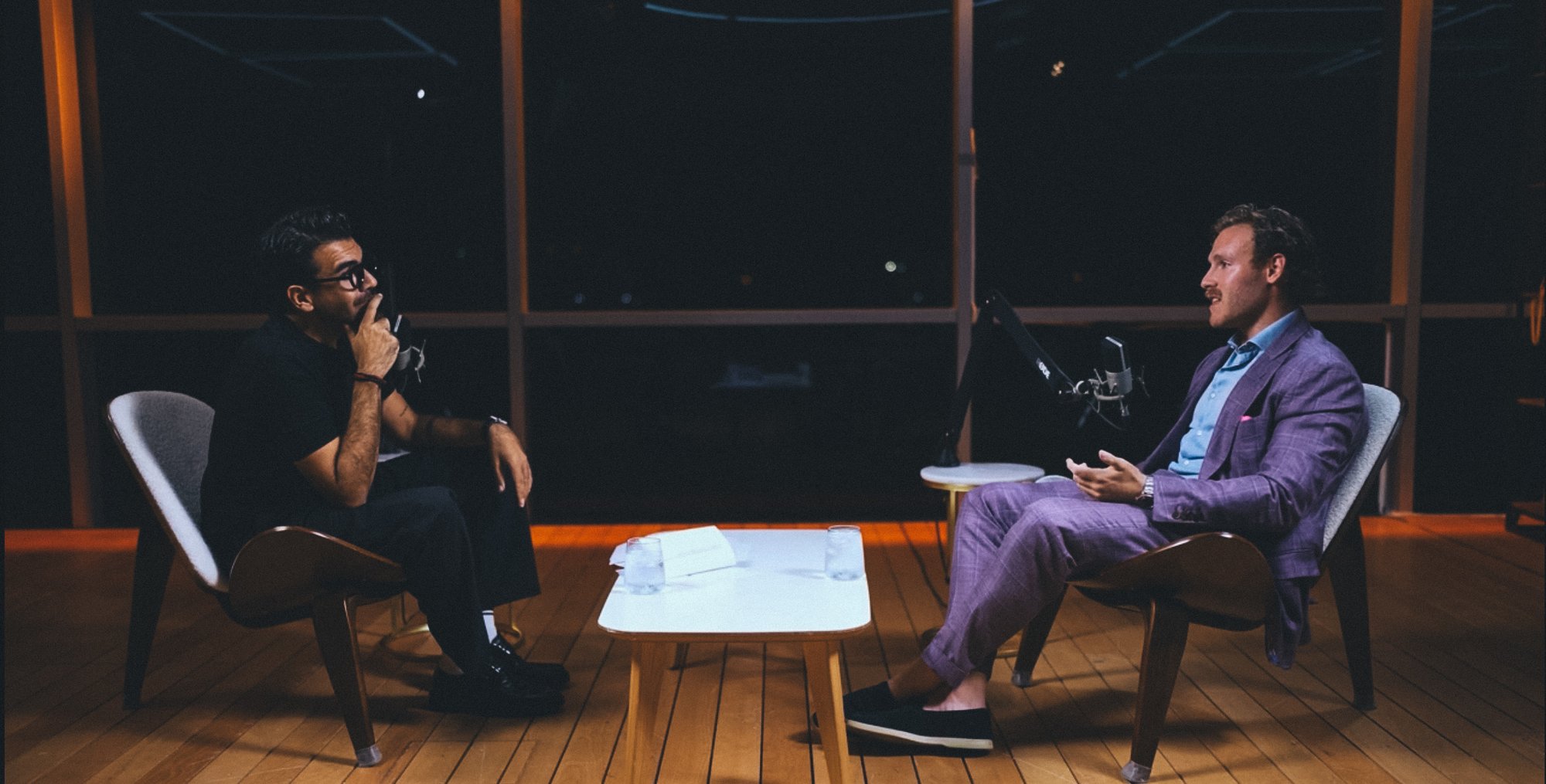 A late-night studio conversation behind broadcast microphones