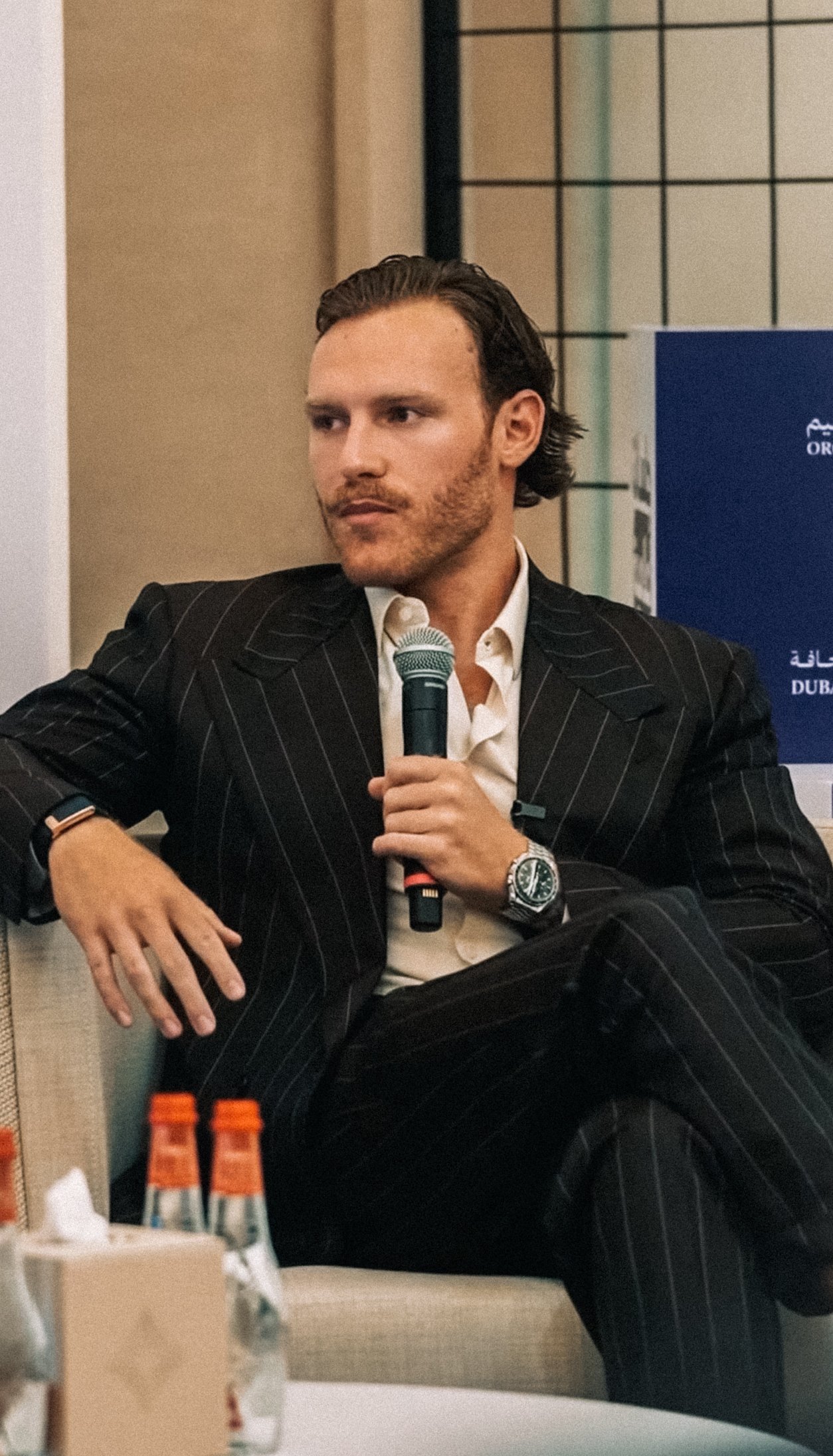 Antonio Lekic speaking with a microphone at a Dubai Press Club session