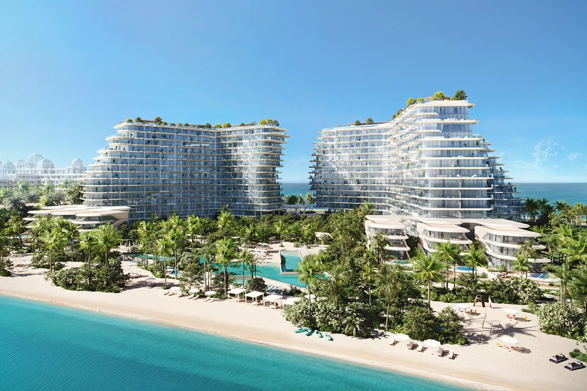 Aerial of the two stepped beachfront buildings with lagoon pools