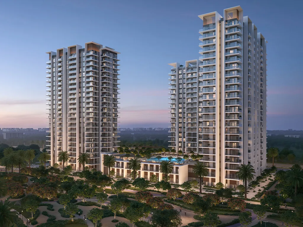 Dusk aerial of two cream towers in parkland