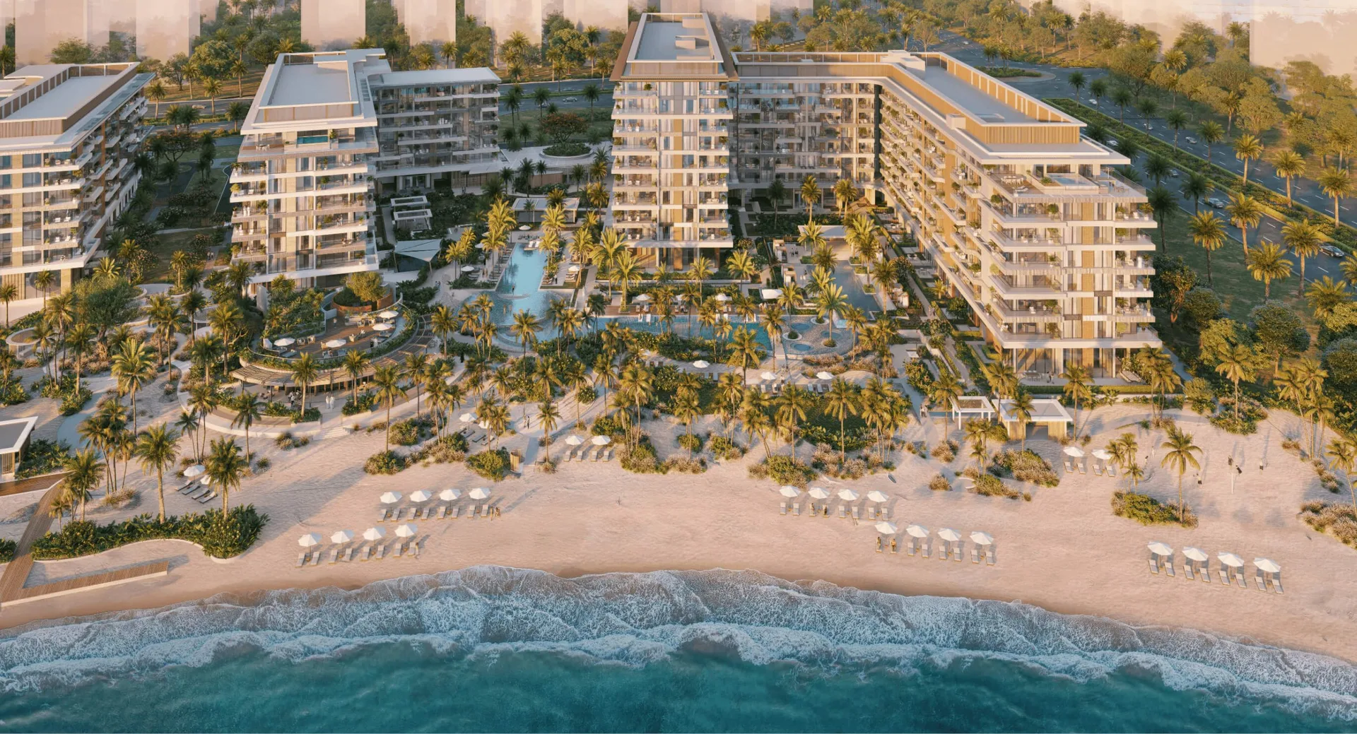 Aerial of the beachfront buildings with pools and open beach