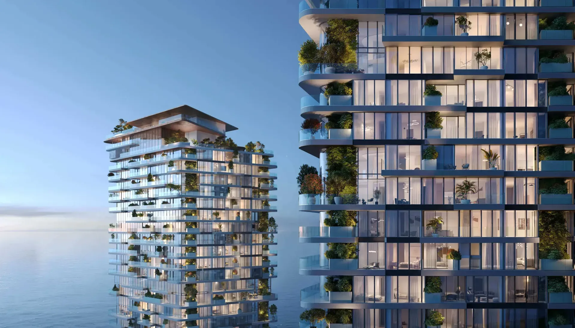 Twin stepped-terrace towers over the sea at dusk